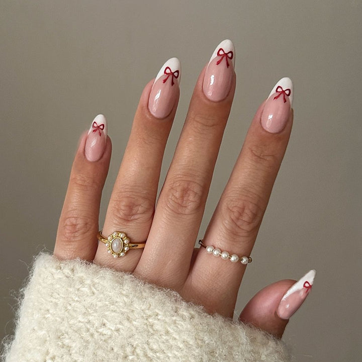 Kunstnagelset mit verspieltem Schleifen-Design Karnz