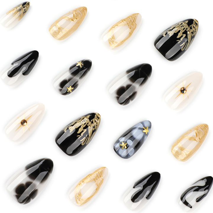 Elegante Stiletto-Kunstnägel mit Goldakzenten und modernen Designs Karnz