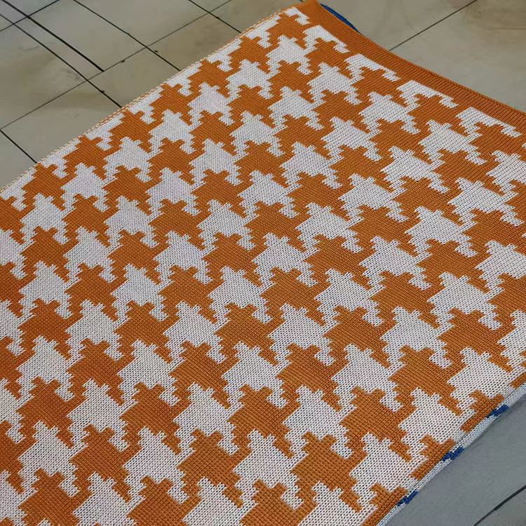 Hahnentrittmuster Strickwurfdecke
