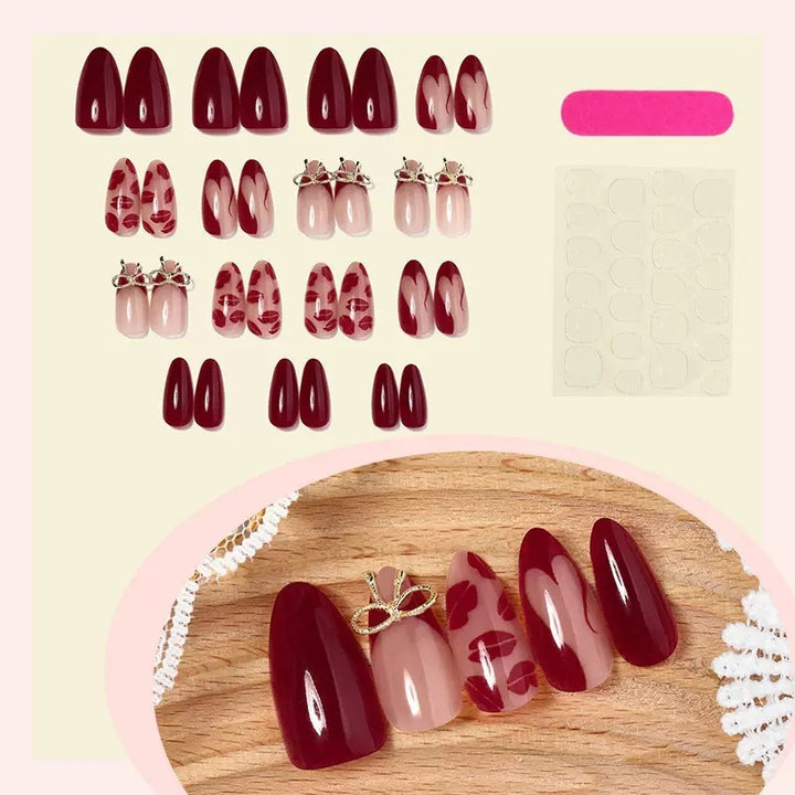 Kunstnagelset mit eleganten Lippenmotiven und Schleifenverzierungen Karnz