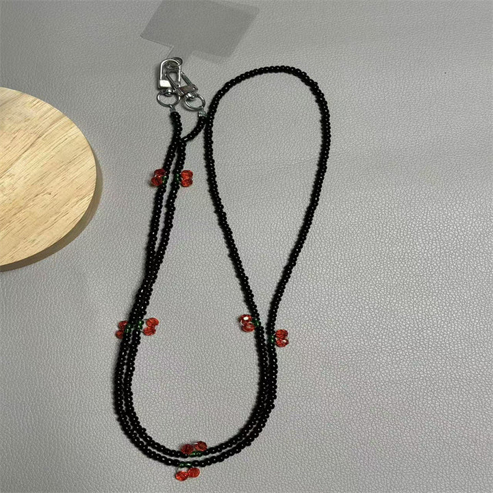 Perlen-Brillenband mit künstlerischen Charms Karnz