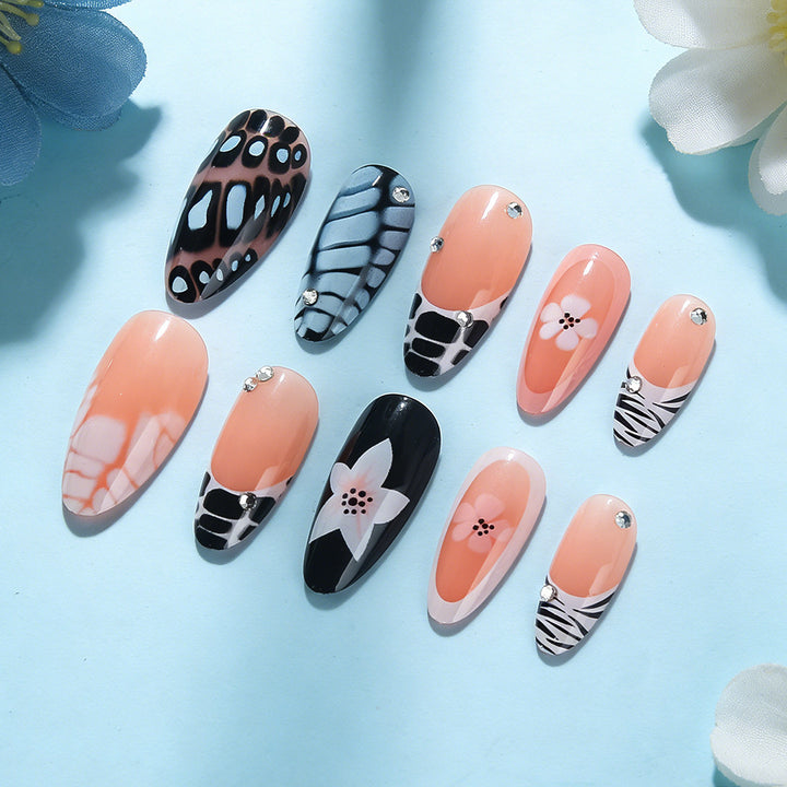 Künstlerisches Press-On Nagelset mit floralem und texturiertem Design Karnz