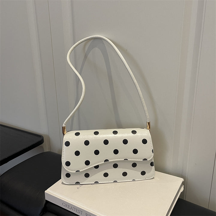 Schicke gepunktete Schultertasche