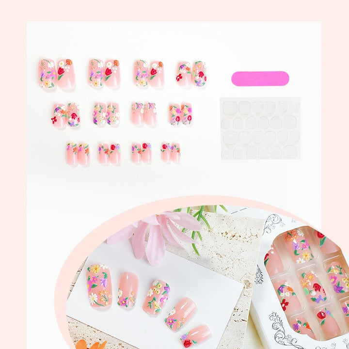 Kunstnagelset mit Blumenmotiven und Glitzerakzenten Karnz