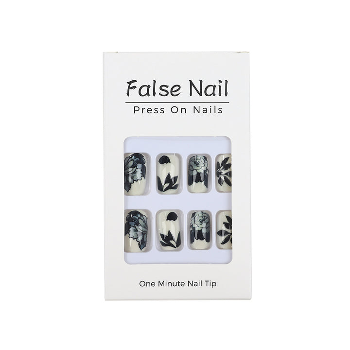 Kunstnägel mit floralem Schwarz-Weiß-Design Karnz
