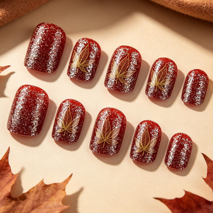 Künstlerisches mit Blättern verziertes Nageldesign Karnz