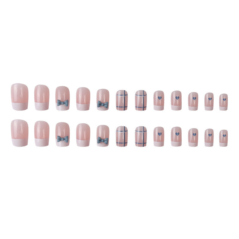 Dekoratives Press-On Nagelkunst-Set mit Schleifen- und Herzdesign Karnz