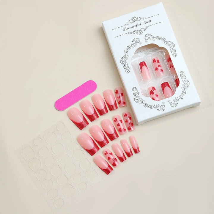 Kunstnagelset mit glamourösen Herzmotiven und Glitzerakzenten Karnz