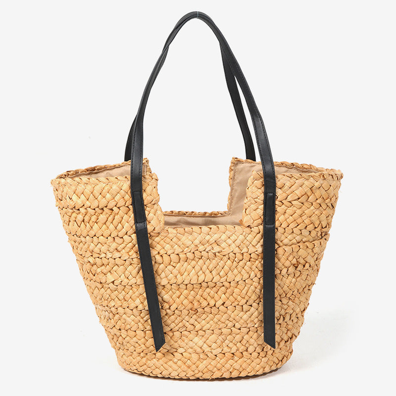 Damen Handtasche aus geflochtenem Naturmaterial mit eleganten Ledergriffen Karnz
