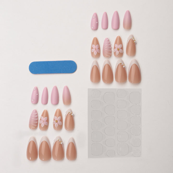 Kreatives Kunstnagelset mit floralem und schimmerndem Design Karnz