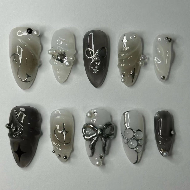 Elegante Kunstnägel mit modernen Design und Glitzerakzenten Karnz