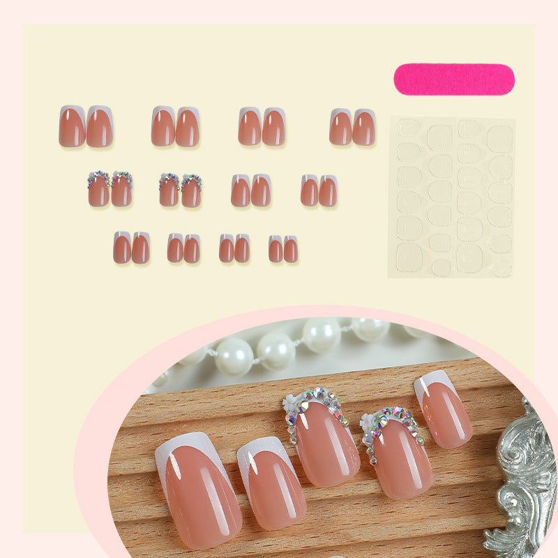 Dekorativer French Tip Press-On Nagelset mit Strass-Akzenten Karnz