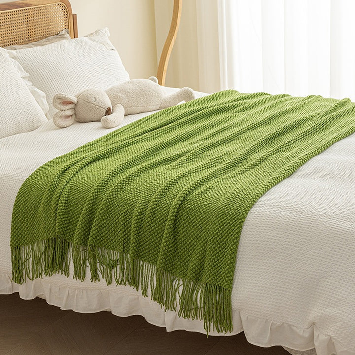 Strukturierte Strickwurfdecke