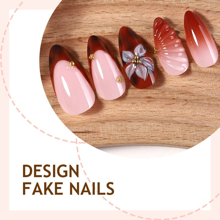 Kunstnagelset mit detailliertem Ombre-Design und kreativen Blütenakzenten Karnz