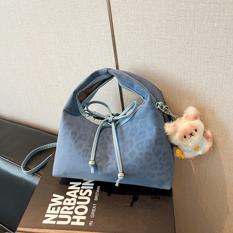 Stylische und funktionale Drawstring-Handtasche Karnz