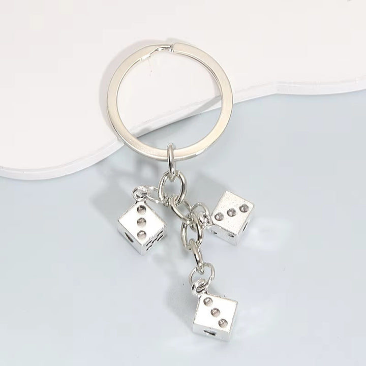 Würfel-inspirierter Charm-Schlüsselanhänger Karnz