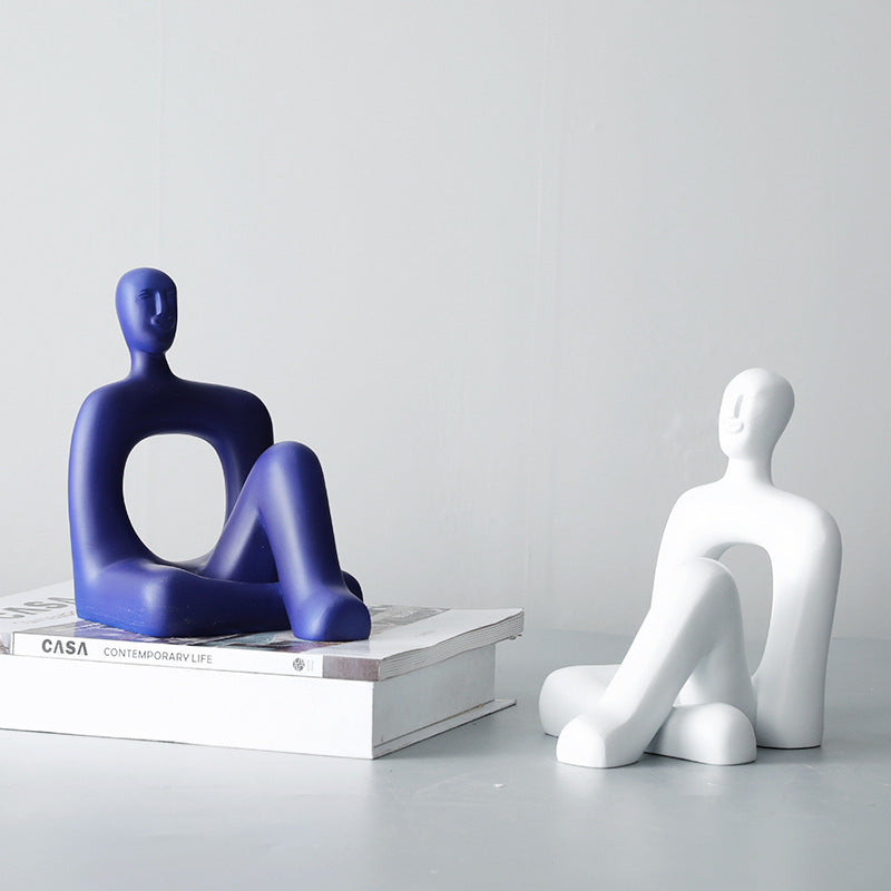 Abstrakte dekorative Sitzfigur