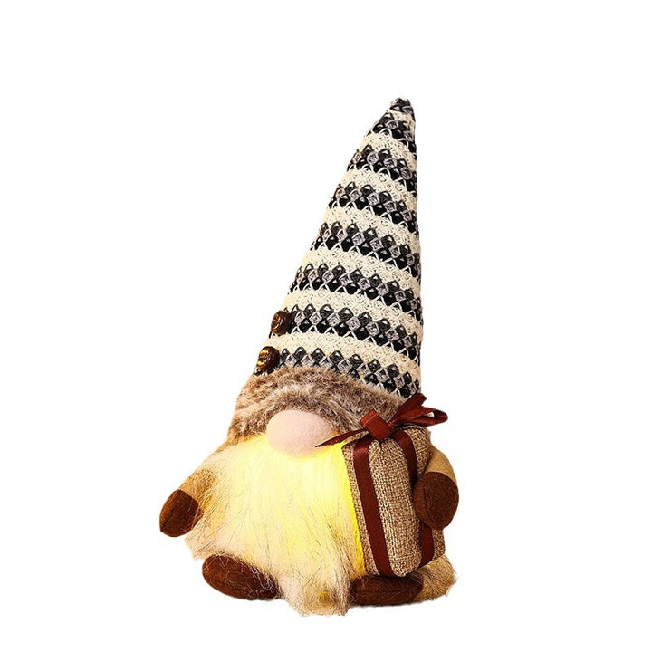 Dekorativer Weihnachtsgnom mit Geschenkpäckchen Karnz