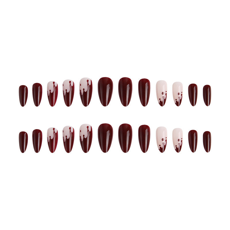 Kunstvolle Nagelspitzen mit Tropfen-Design Karnz