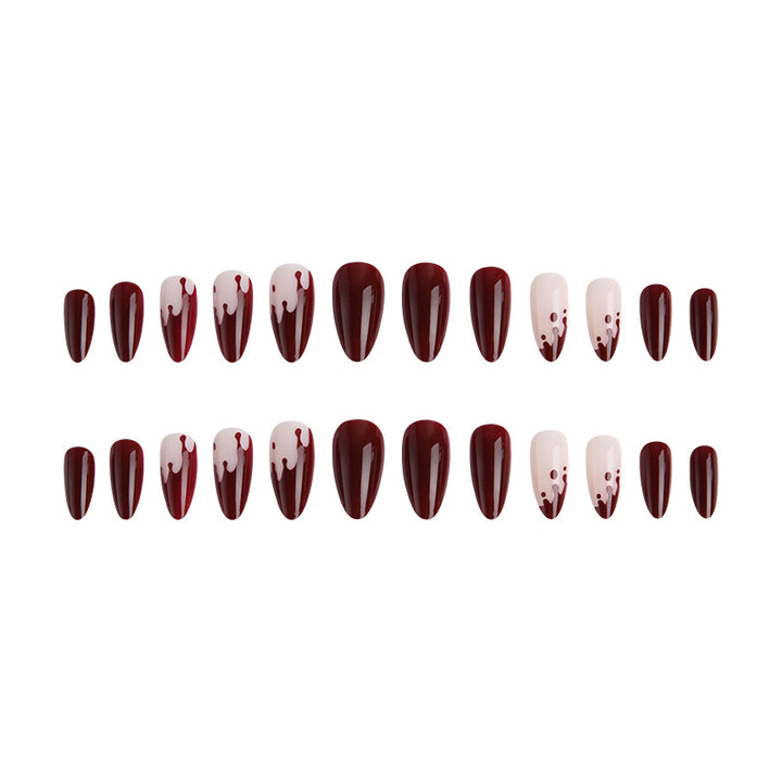 Kunstvolle Nagelspitzen mit Tropfen-Design Karnz