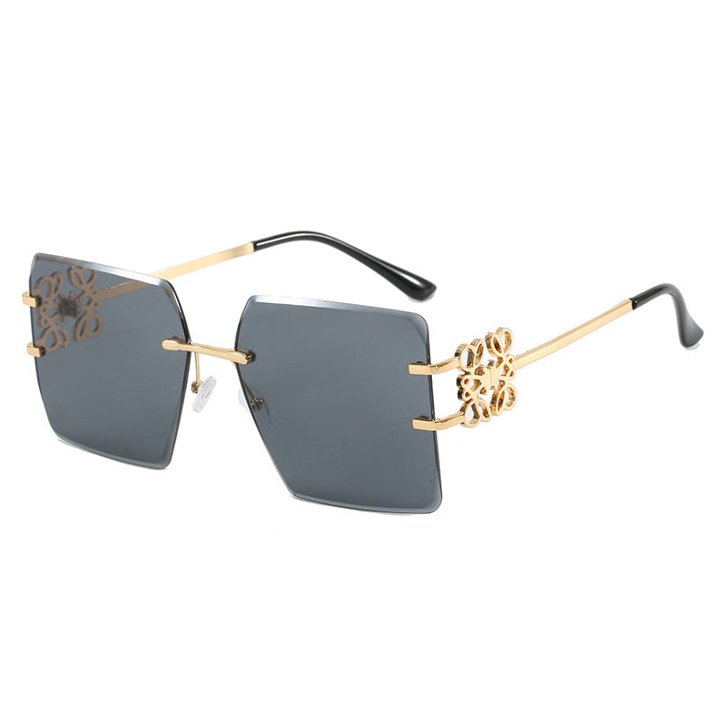 Damen modische Sonnenbrille mit außergewöhnlichem Design und goldenen Akzenten Karnz