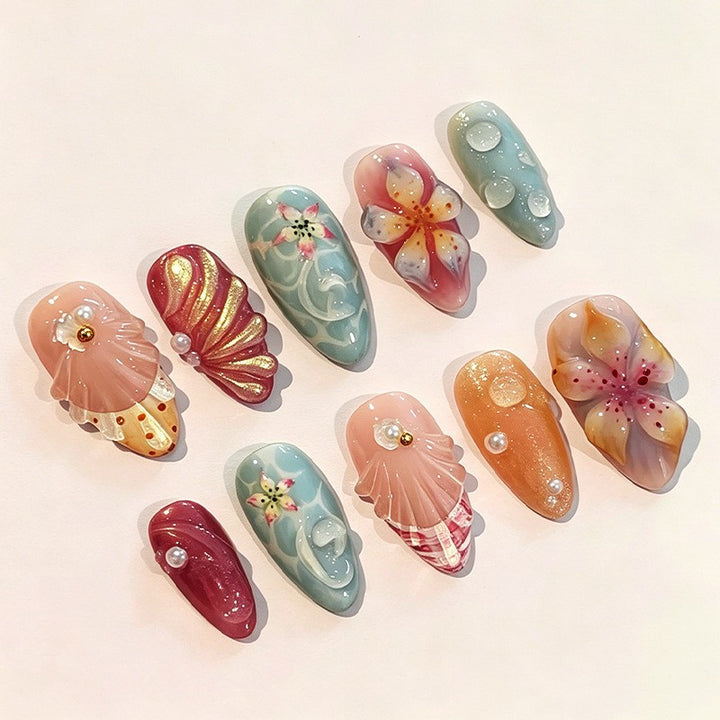 Kunstnagelset mit floralem 3D-Design und Glitzerakzenten Karnz