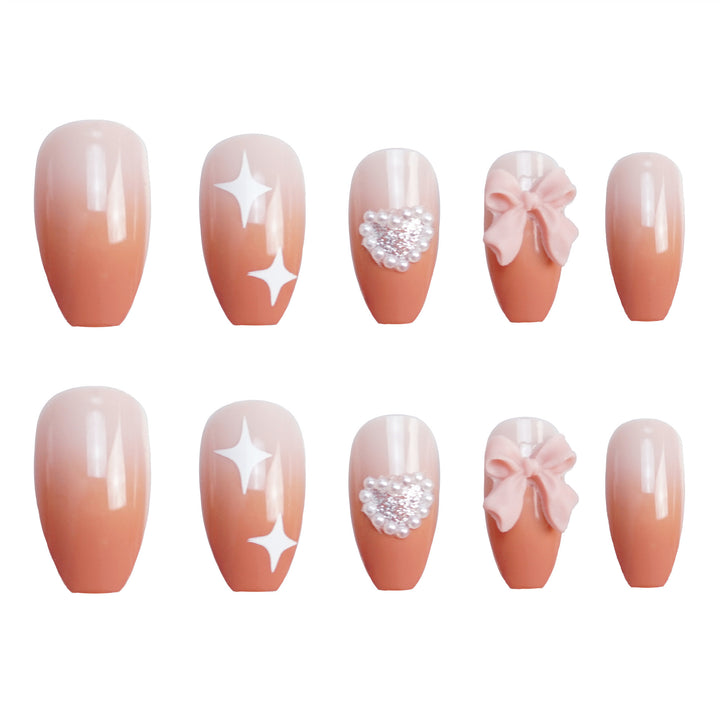 Dekorativer Press-On-Nagelset mit Strass- und Schleifenakzenten