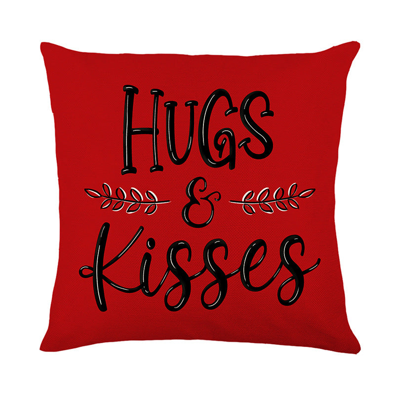 Quadratisches Baumwoll-Leinen Dekokissenbezug mit handgeschriebener Schrift von 'Hugs & Kisses' und Lorbeerakzent