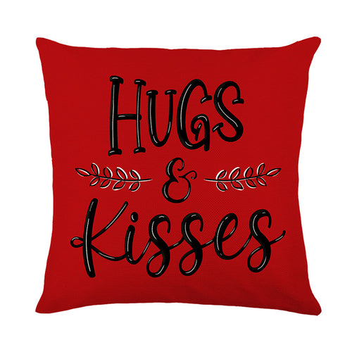 Quadratisches Baumwoll-Leinen Dekokissenbezug mit handgeschriebener Schrift von 'Hugs & Kisses' und Lorbeerakzent