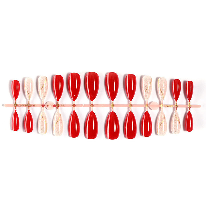 Kunstnagelset mit glänzender roter Oberfläche und stilvollen Akzenten Karnz