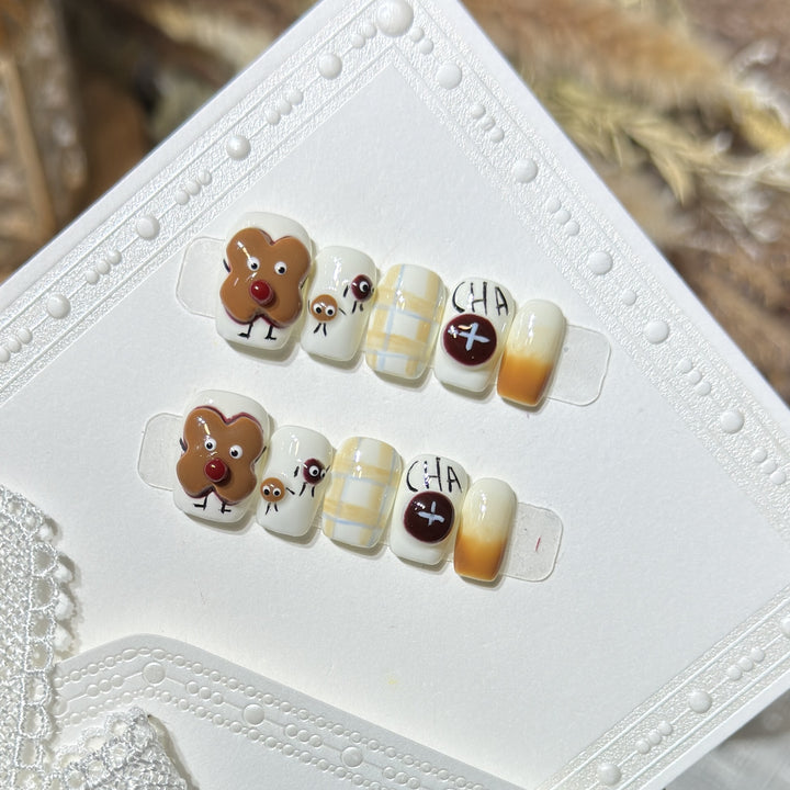 Verspieltes Lebkuchen Press-On Nagelkunst Set Karnz