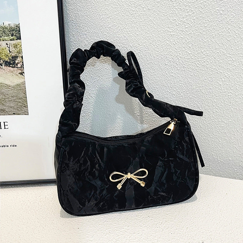 Elegante Schultertasche mit Schleifenverzierung