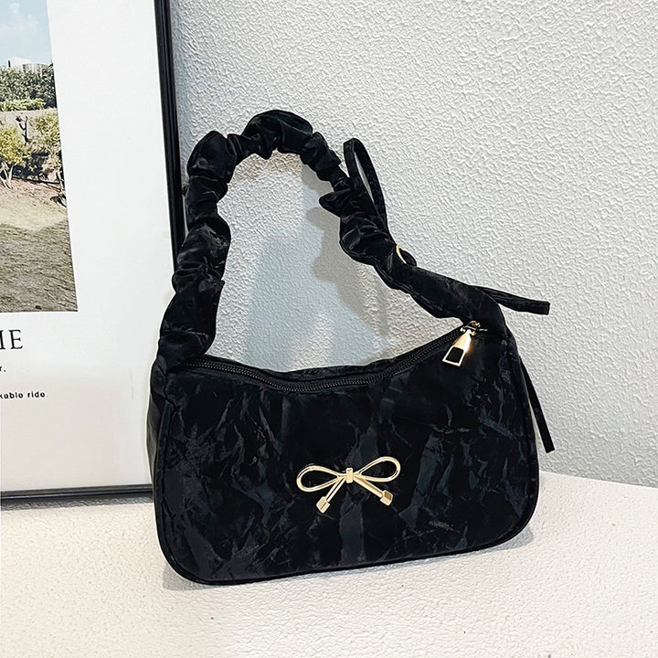 Elegante Schultertasche mit Schleifenverzierung