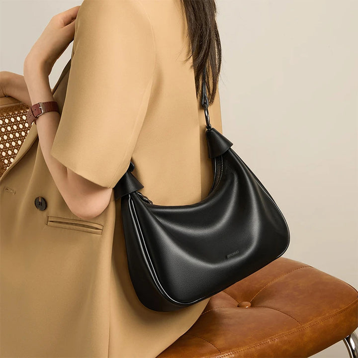 Stylische geschwungene Schultertasche Karnz