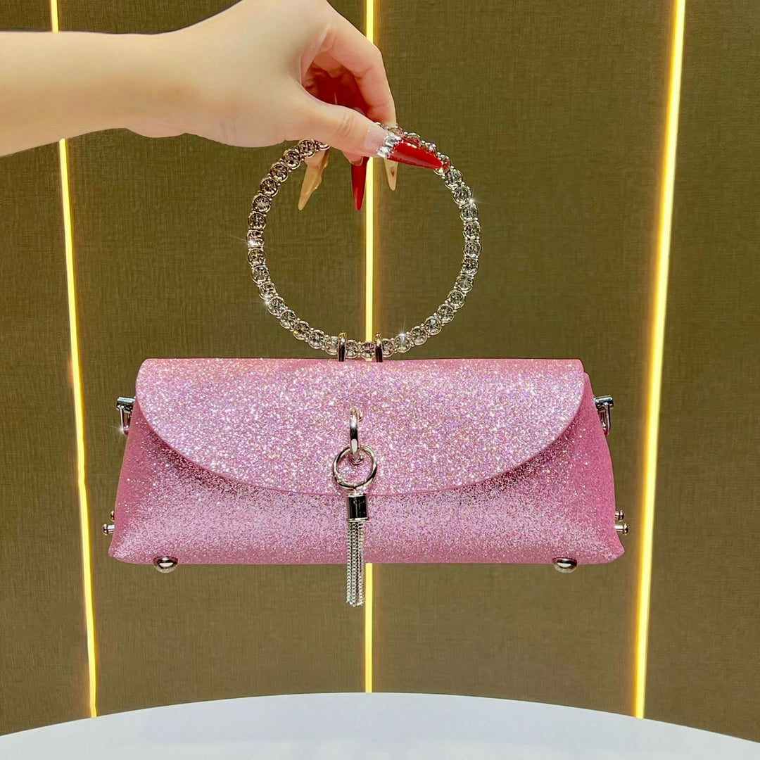 Glitzernde Clutch mit Strassgriff für den Abend