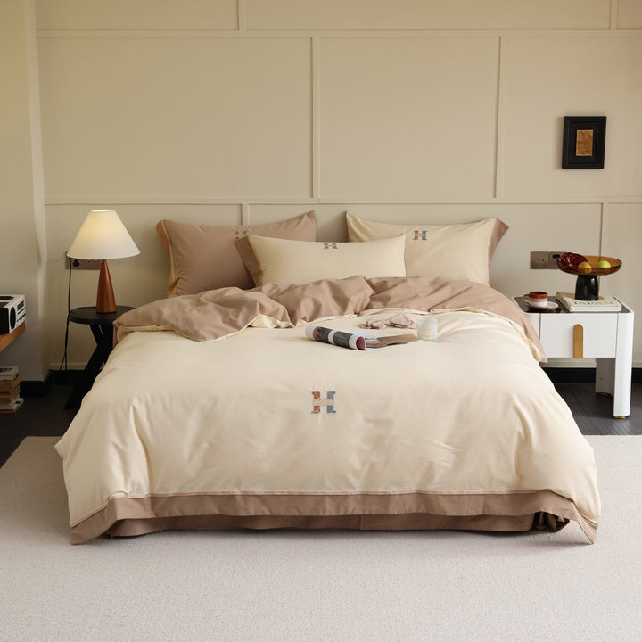 Zweifarbiges Luxus-Baumwoll-Percale-Bettwäsche-Set mit wendbarem Finish und besticktem Monogramm