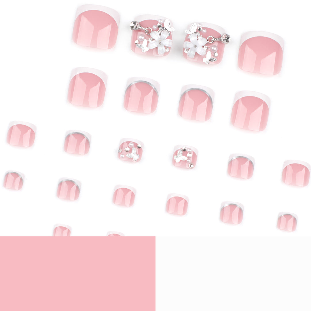 Kunstvolle Fußnagelgestaltung mit eleganten Blüten- und Glitzerakzenten Karnz