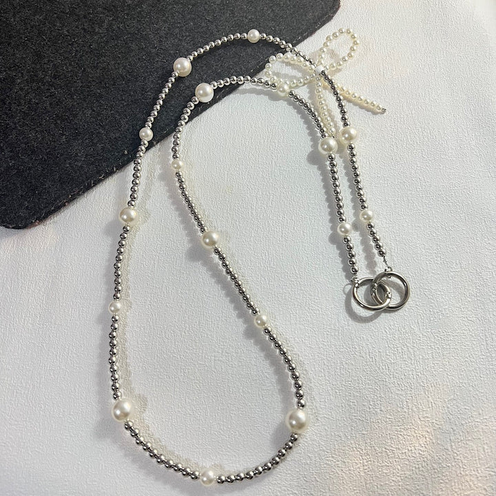 Elegante Perlen- und Kettenhalskette Karnz