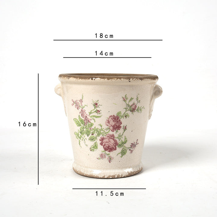 Dekorativer Blumentopf mit floralen Verzierungen Karnz