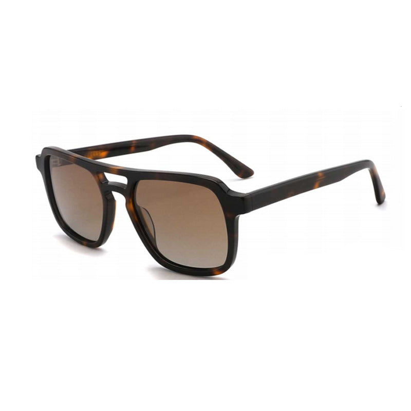 Damen Sonnenbrille mit robustem, stilisierten Kunststoffrahmen und harmonisch verlaufenden Gläsern Karnz