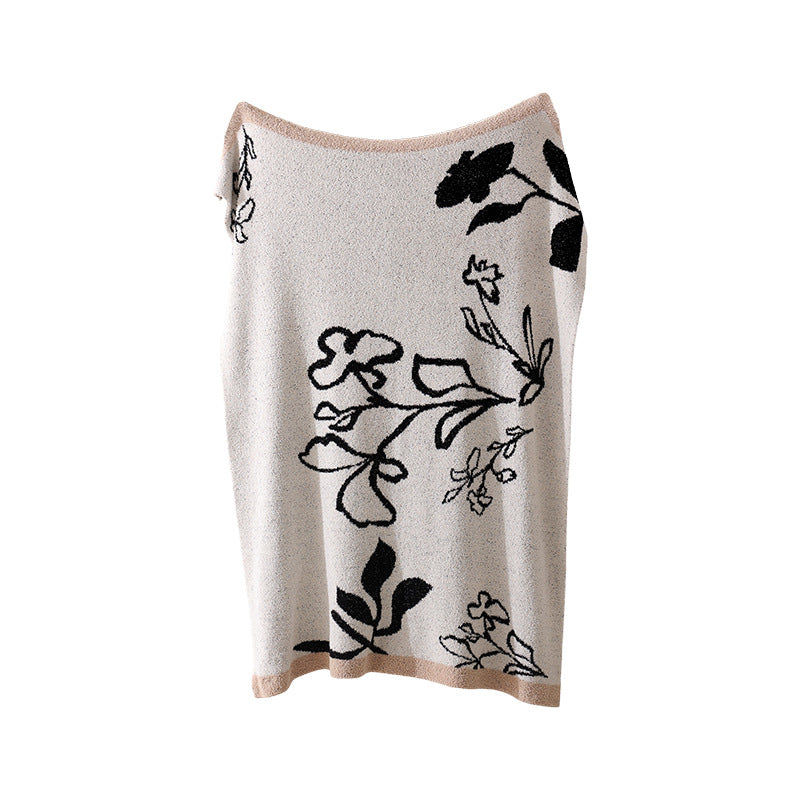 Grobgewebte Wohndecke mit geometrischem Jacquardmuster und weichem Bouclé Karnz