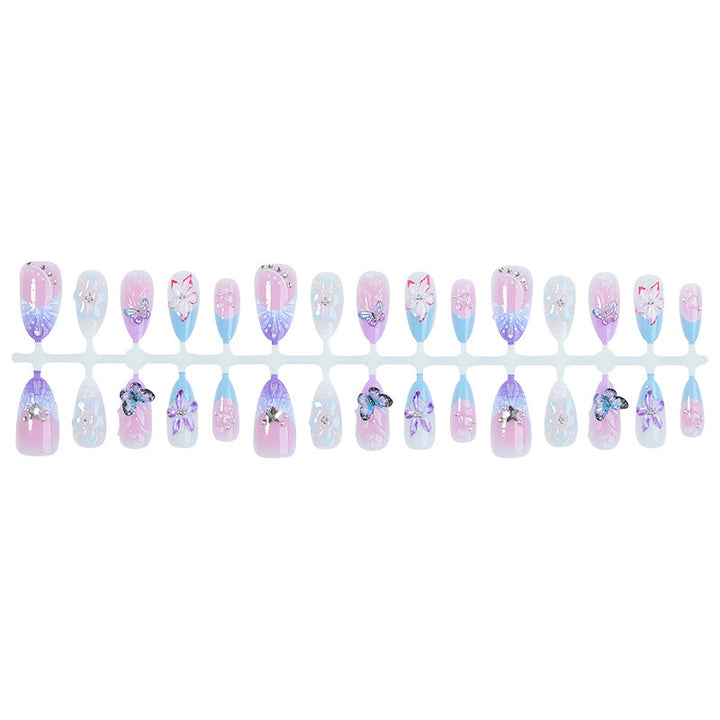 Kreatives Kunstnagelset mit floralen und Schmetterlingsmotiven Karnz