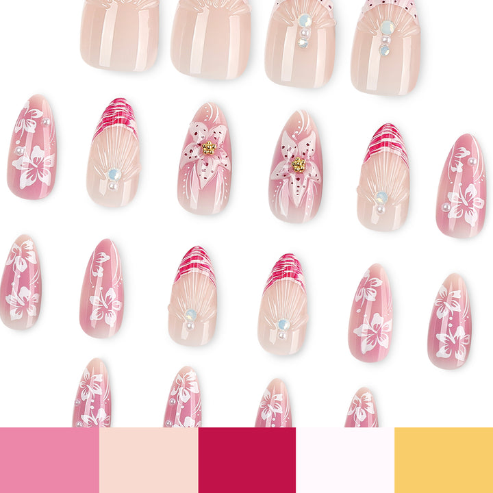 Kunstvolle Nagelverlängerungen mit floralen und glitzernden Akzenten Karnz