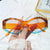 Damen modische Sonnenbrille mit markantem, futuristischem Design Karnz