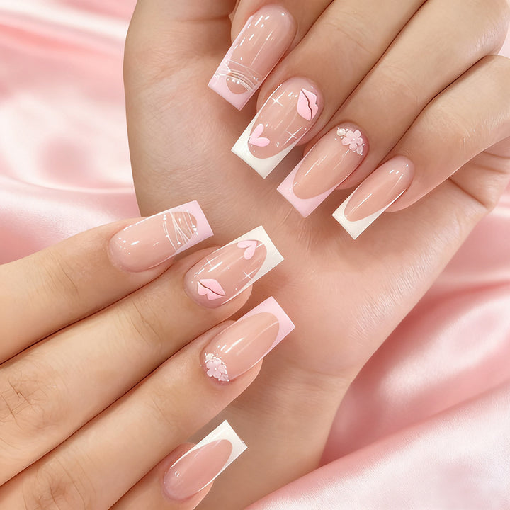Künstlerisches Press-On-Nagelset mit floralen und herzförmigen Akzenten Karnz
