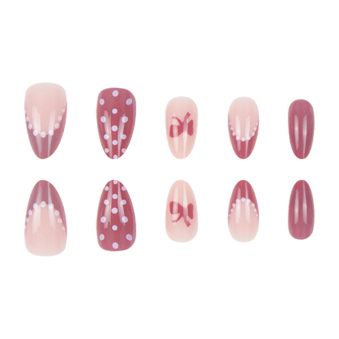 Künstlerisches Press-On-Nagelset mit Schleife und gepunktetem Design Karnz
