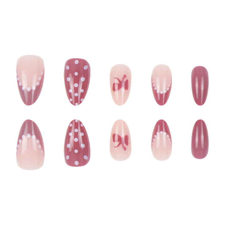 Künstlerisches Press-On-Nagelset mit Schleife und gepunktetem Design Karnz