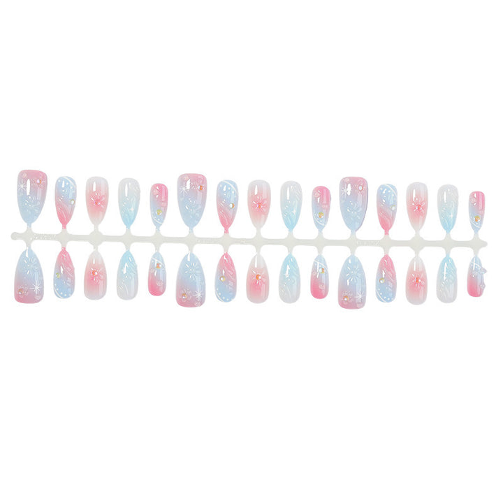 Kunstnagelset mit elegantem Farbverlauf und floralem Design Karnz
