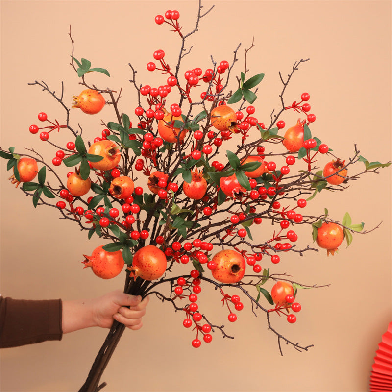 Dekorative Granatapfelblütenarrangement