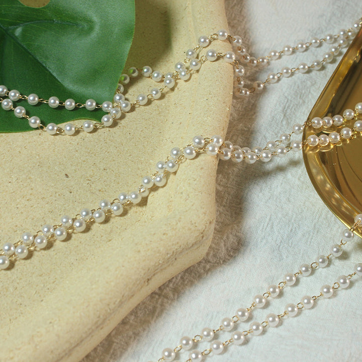 Elegantes Perlenbrillenband Karnz